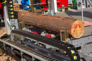 Raw lumber going through optimization using Structured light laser illumination